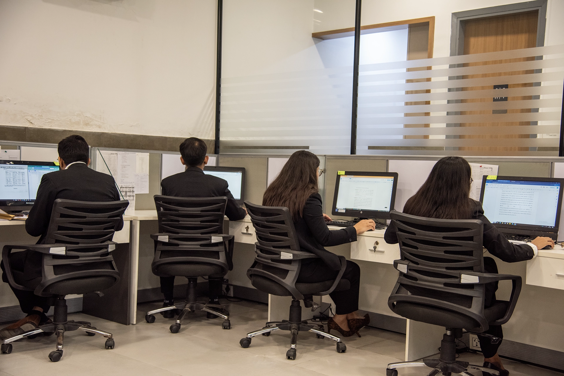 Advocates at work in the Delhi office of Ajit Kakkar and Associates