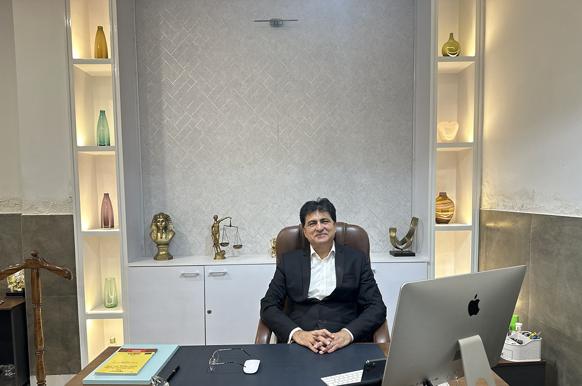 Wg Cdr Ajit Kakkar at his desk in the firm's office